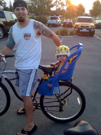 "Taylor Takes Bike Ride With Daddy"