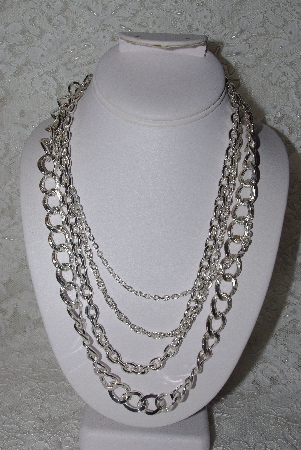 +MBAMG #11-769  "Silvertone 4 Strand Necklace"