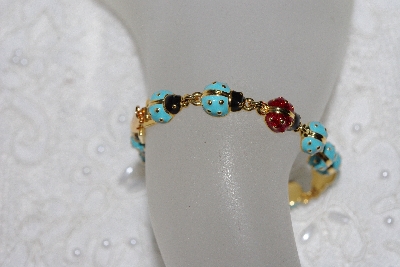 +MBAMG #11-918  "Joan Rivers Enameled Lady Bug Bracelet"