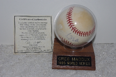 +MBAMG #018-013  "1995 World Series Autographed Greg Maddux Baseball With Holder & Cert"
