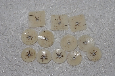 **MBAMG #T06-171  "1980's Set of 9 Hand Made Bone Buttons"