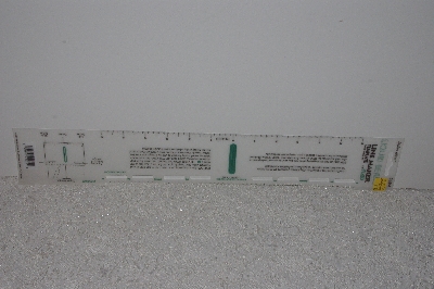 +MBAMG #009-276  "1992 Plaid Liquid Bead Line Maker"