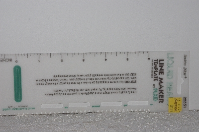 +MBAMG #009-276  "1992 Plaid Liquid Bead Line Maker"