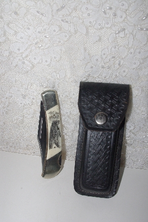 +MBAMG #099-217  "Frost Cutlery Grizzly Bear Scrimshaw Folding Knife & Case"