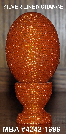 +MBA #4242-1696  "Silver Lined Orange Glass Seed Bead Egg With Matching Egg Cup"