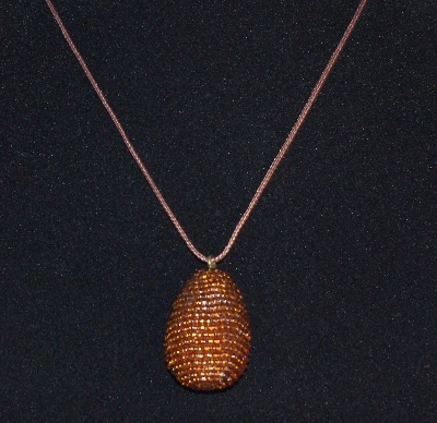 +MBA #EA-0032  "Hand Glass Beaded Rootbeer Brown Egg Pendant"