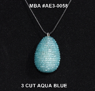 +MBA #AE3-0058  "3 Cut Aqua Blue Glass Seed Bead Egg Pendant"
