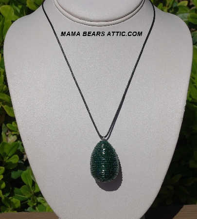 +MBA #5557-0028  "2 Cut Dark Green Glass Seed Bead Egg Pendant"