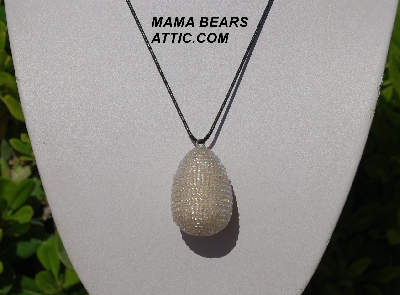 +MBA #5557-0044  "Clear Luster Glass Seed Bead Egg Pendant"
