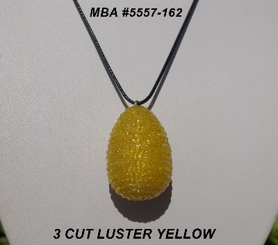 +MBA #5557-162  "3 Cut Yellow Glass Seed Bead Egg Pendant"