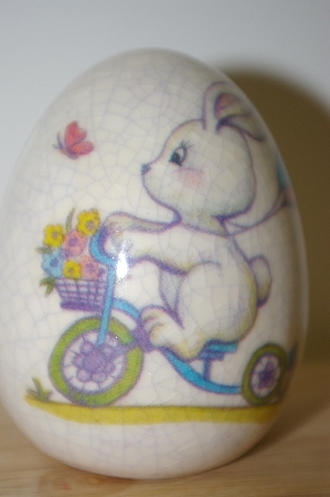 +MBA #10-037  1980's MBA #10-037  Porceline Cracked Finish Bunny On A Bike Egg