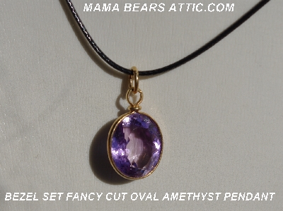 +MBA #5600-328  "Bezel Set Fancy Cut Oval Amethyst Pendant With 18" Black Cord"