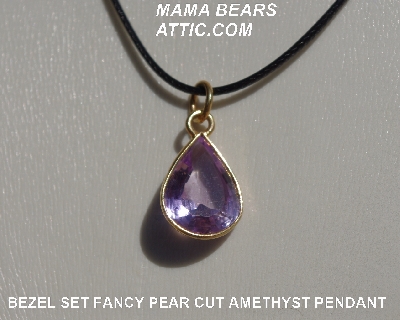 +MBA #5600-334  "Bezel Set Fancy Pear Cut Amethyst Pendant With 18" Black Cord"