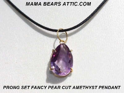 +MBA #5600-340  "Prong Set Fancy Pear Cut Amethyst Pendant With 18" Black Cord"
