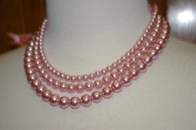 + Triple Strand Pink Glass Pearl Necklace