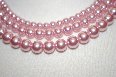 + Triple Strand Pink Glass Pearl Necklace