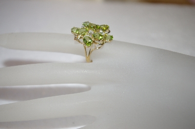 +MBA #17-263  9 Stone Oval Cut Peridot 14K Ring