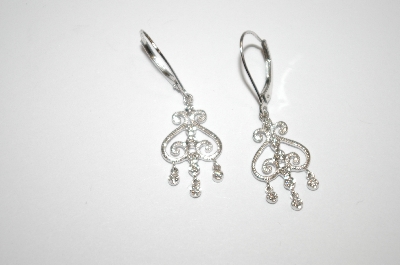 +MBA #19-614  10K White Gold Diamond Scroll Earrings