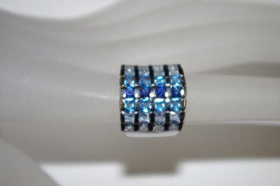 +MBA #21-299  Platinum Plated Silver Created Blue Sapphire Tonal Ring