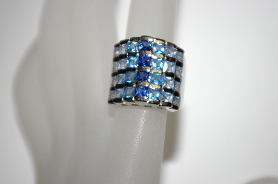 +MBA #21-299  Platinum Plated Silver Created Blue Sapphire Tonal Ring