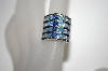 +MBA #21-299  Platinum Plated Silver Created Blue Sapphire Tonal Ring