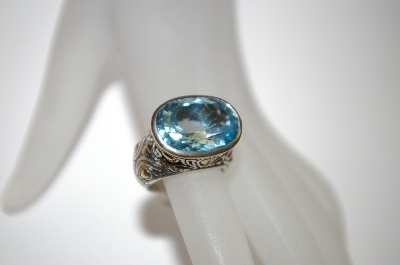 +MBA #21-128  Sterling/18K Blue Topaz Ring
