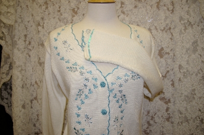 +MBA #16-022   "Limited Edition White Embroidered Storybook Sweater