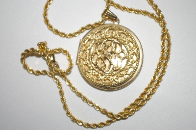 +MBA #25-278  "Made In Korea Gold Plated Round Locket