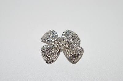 +MBA5  # -1649  Rhodium Plated Clear Crystal Bow Brooch