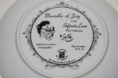 +MBA #69-076   "1988 Sue Etem "Bundles Of Joy" Collectors Plate With Oak & Glass Plate Frame