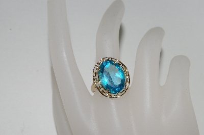 +MBA #80-0087  14K Yellow Gold Oval Cut Blue Topaz Ring