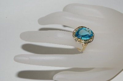 +MBA #80-0087  14K Yellow Gold Oval Cut Blue Topaz Ring