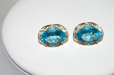 +MBA #80-0074     14k Yellow Gold Oval Cut Blue Topaz Earrings