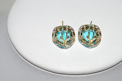 +MBA #80-0074     14k Yellow Gold Oval Cut Blue Topaz Earrings