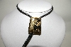 +MBA #81-132  "Gold Plated Black Enamel Double Horseshoe Bolo Tie
