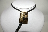 +MBA #81-132  "Gold Plated Black Enamel Double Horseshoe Bolo Tie