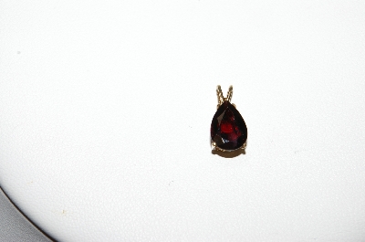 +MBA #85-215     14K Yellow Gold Pear Cut Garnet Pendant