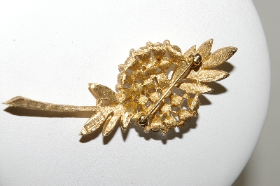 +MBA #87-318  "Trifari Gold Tone Crystal Rhinestone Flower Brooch