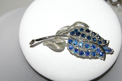 +MBA #87-292  "Lisner AB & Blue Rhinestone Flower Brooch