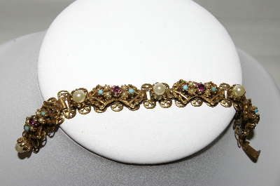 +MBA #88-072   Gold Plated Purple Rhinestone & Faux Pearl Bracelet