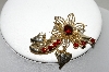 +MBA #87-070   Gold Tone Red Rhinestone Flower Pin