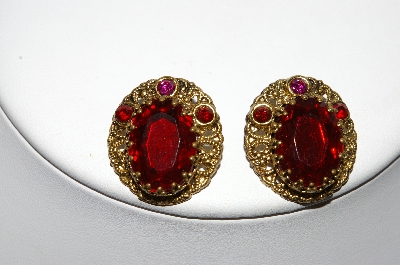 +MBA #87-042   Made In West Germany Gold Tone Red Rhinestone Clip On Earrings