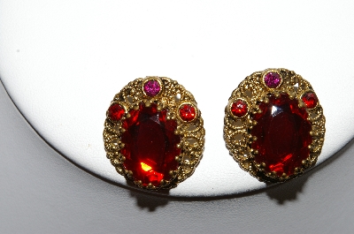 +MBA #87-042   Made In West Germany Gold Tone Red Rhinestone Clip On Earrings