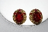 +MBA #87-042   Made In West Germany Gold Tone Red Rhinestone Clip On Earrings