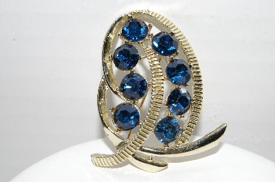 +MBA #92-096 "Kramer Goldtone Blue Rhinestone Swirl Brooch"