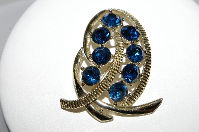 +MBA #92-096 "Kramer Goldtone Blue Rhinestone Swirl Brooch"