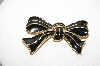 +MBA #97-003 "Trifari Goldtone Black Enameled Bow Brooch"