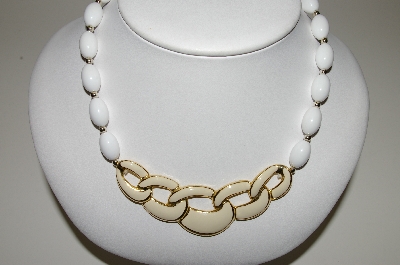 +MBA #94-304  "Napier Goldtone White Bead Necklace With Enameled Center Piece"