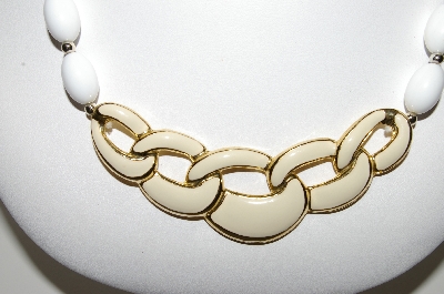+MBA #94-304  "Napier Goldtone White Bead Necklace With Enameled Center Piece"
