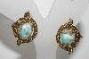 +MBA #E42-170  "Sarah Coventry Goldtone Faux Turquoise Clip On Earrings"